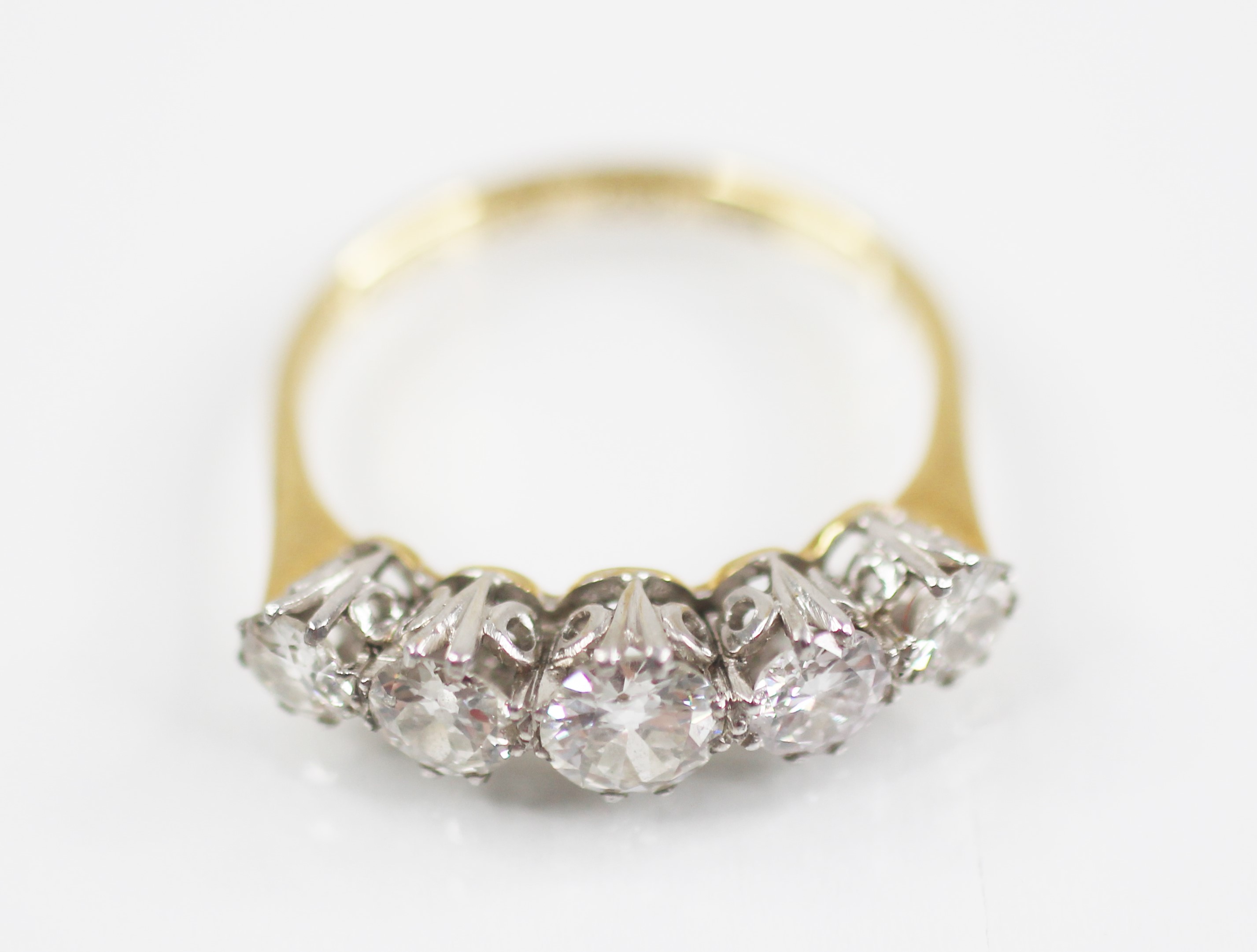 An early 20th century five stone diamond ring, the central round brilliant cut diamond - Image 5 of 6