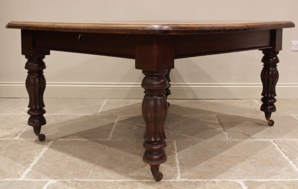 A Victorian mahogany extending dining table, the rectangular moulded top with rounded corners, - Image 4 of 4