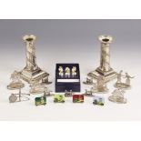 A selection of novelty place card holders, to include five Burmese silver coloured examples,