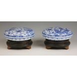 A pair of Chinese porcelain blue and white boxes and covers, Qianlong seal mark, each circular box