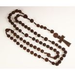 A set of French carved wooden rosary beads, early 20th century, a souvenir of Lourdes, 127cm long