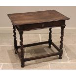 An oak side table, early 18th century, the moulded three plank top over a single frieze drawer, upon