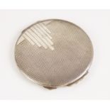 A George VI Art Deco silver compact, W I Broadway & Co, Birmingham 1946, of circular form with