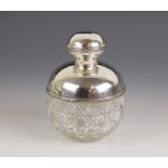 An Edwardian cut glass silver mounted scent bottle, Birmingham 1909 (maker's mark worn), of globular