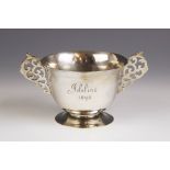 A Victorian silver twin-handled trophy cup, Wakely & Wheeler, London 1897, the circular bowl with