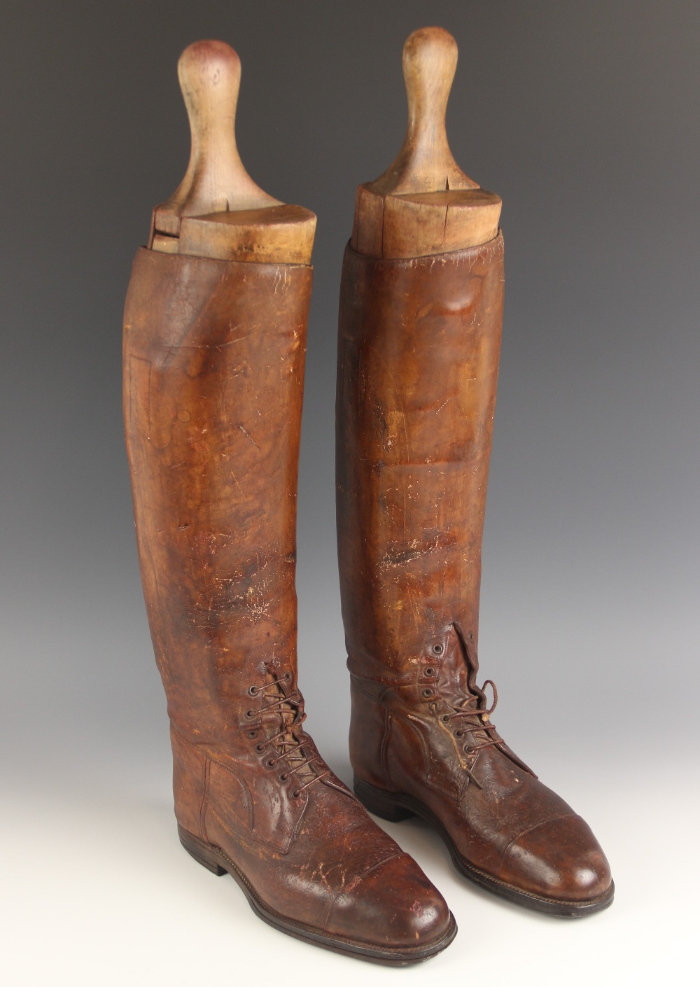 A pair of gentleman's part-laced leather riding boots, 28.5cm heel to toe, 48.5cm high, with