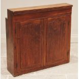 A Victorian stained pine wall mounted ecclesiastical cupboard, of inverted square form, the pair