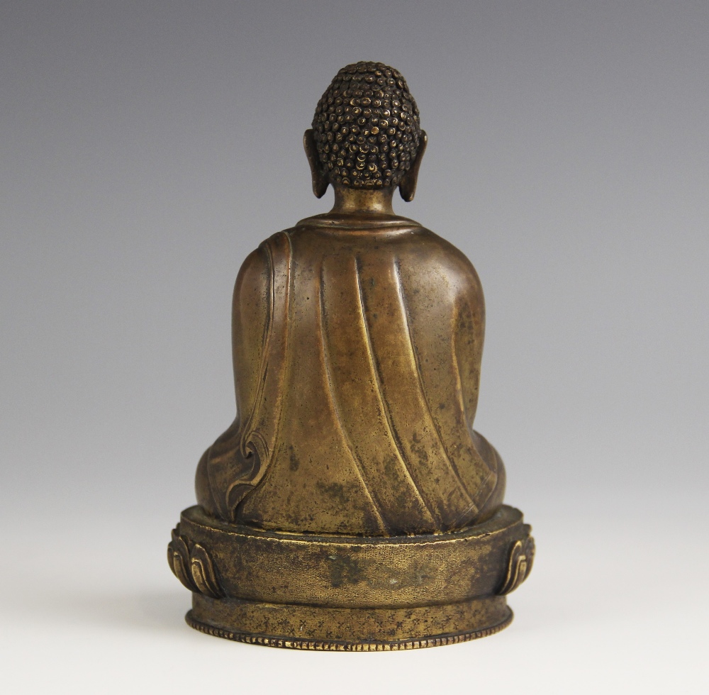 A bronze model of Buddha, possibly Sino-Tibetan, 18th/19th century, modelled seated in dhyanasana on - Image 2 of 5