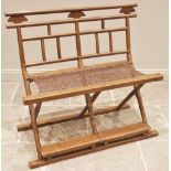 A South East Asian hardwood folding 'travelling chair', early 20th century, the angular back rail