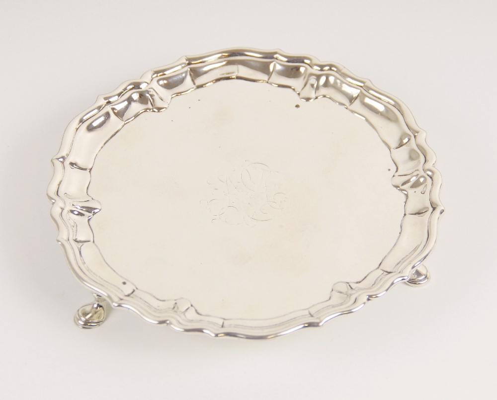 A George II silver waiter John Tuite, London 1735, of circular form with pie crust border on three