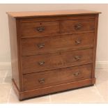 A late Victorian satin walnut chest of drawers, the rectangular moulded top above an arrangement