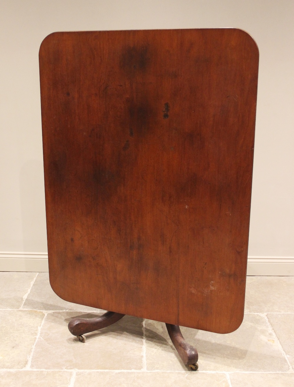 A 19th century mahogany centre/breakfast table, the rectangular tilt top with rounded corners upon a - Image 2 of 2