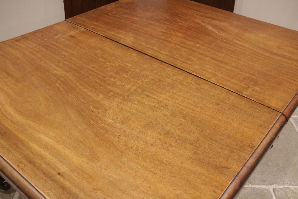 A Victorian mahogany extending dining table, the rectangular moulded top with rounded corners, - Image 3 of 4