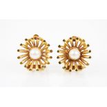 A pair of 18ct gold pearl set clip-on earrings, the central round cultured pearls set to a