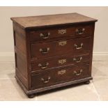 An oak chest of drawers, 18th century and later, the plank top above an arrangement of four long