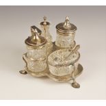 A Victorian cut glass silver mounted cruet set, Henry Manton, Birmingham 1876, comprising