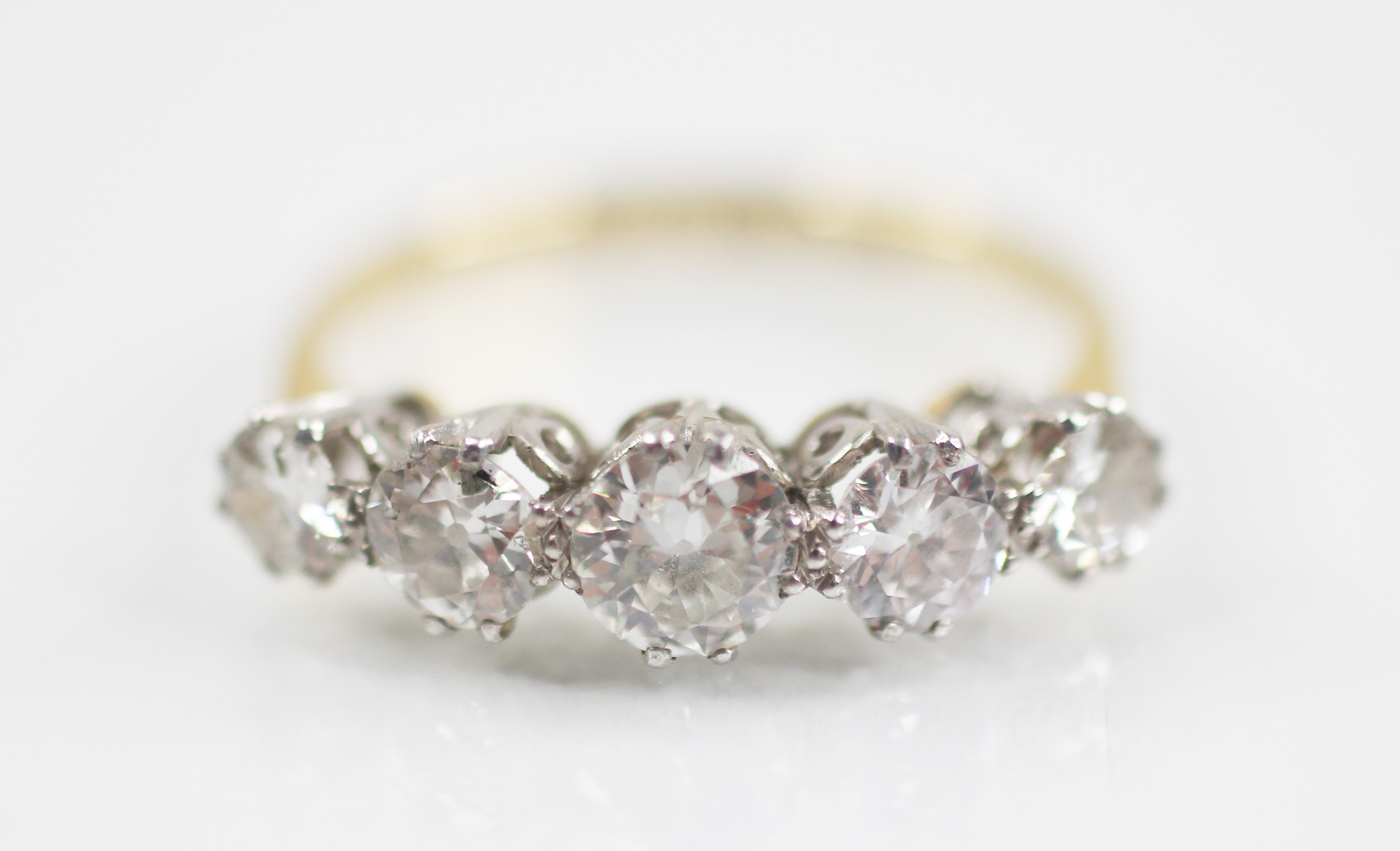 An early 20th century five stone diamond ring, the central round brilliant cut diamond - Image 6 of 6