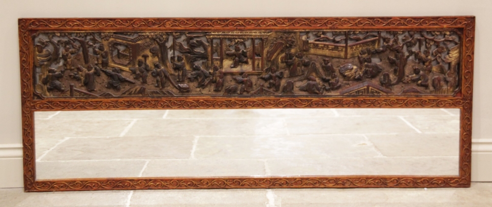 A Chinese carved hardwood and gilt lacquered over mantel mirror, early 20th century, the rectangular