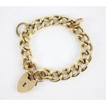 A 9ct gold curb link bracelet, approximately 20cm long, with a heart-shaped padlock fastener, marked