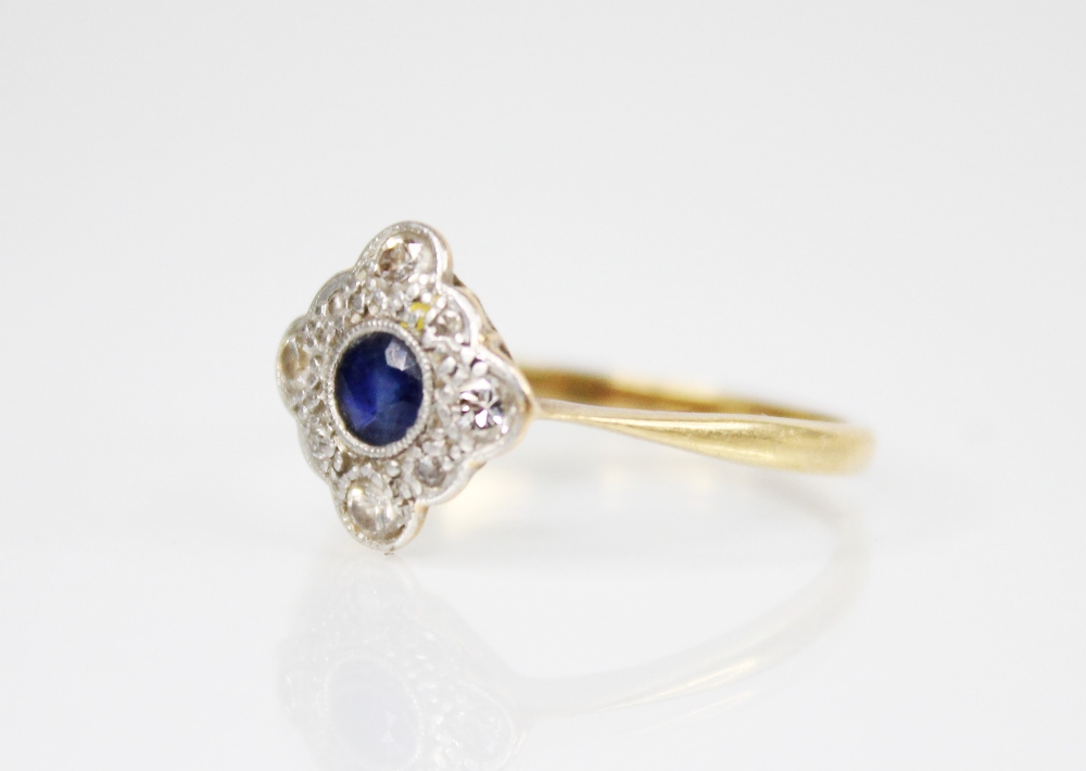 An early 20th century sapphire and diamond transitional ring, the central round mixed cut sapphire - Image 2 of 3