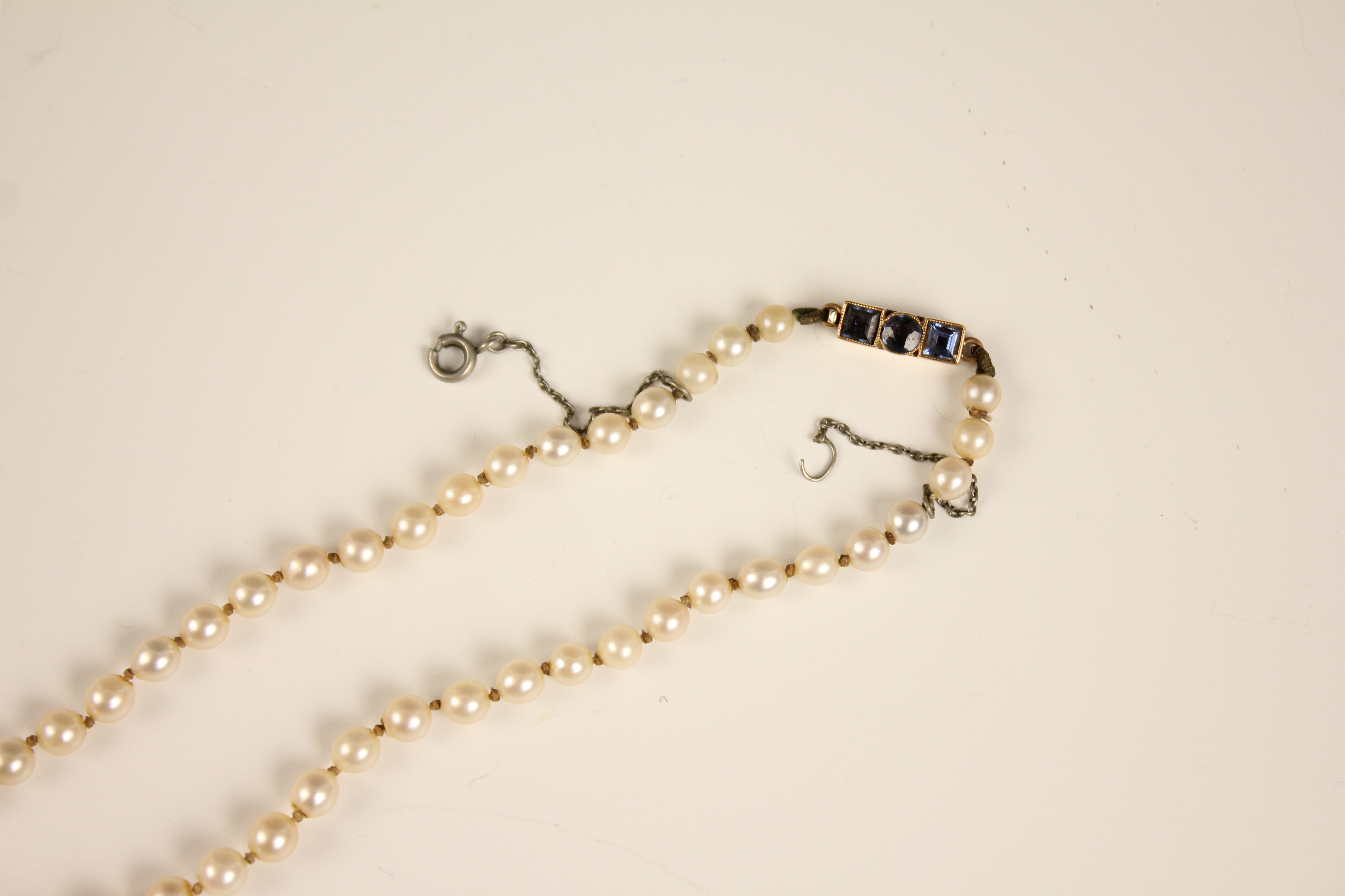 An early 20th century cultured pearl necklace, designed as a single row of round cultured pearls, - Image 9 of 12