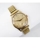 A gentleman's vintage 9ct gold Omega wristwatch, the circular dial with Arabic numerals and arrow