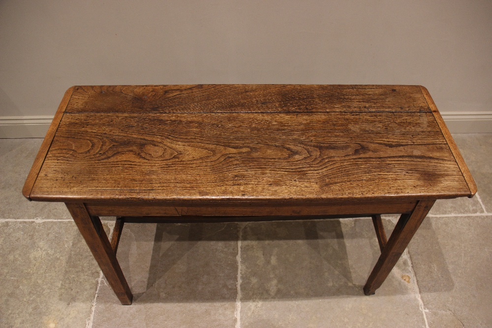 An elm plank top side table, probably French, early 19th century, the cleated top raised upon legs - Image 2 of 10