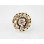 A 19th century and later diamond floral cluster ring, central diamond measuring 6.1mm x 5.7mm,