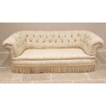 A Victorian country house button back Chesterfield sofa, upholstered in foliate damask fabric, of