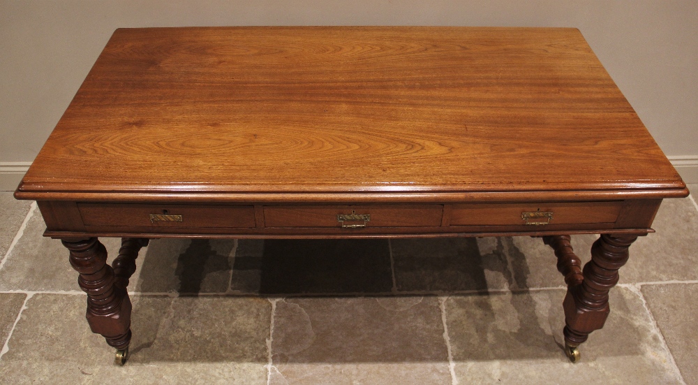 A late Victorian walnut library/writing table by Maple & Co, the rectangular thumb moulded top above - Image 2 of 3