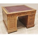 A late Victorian oak and pollard oak twin pedestal partners desk, the rectangular moulded top
