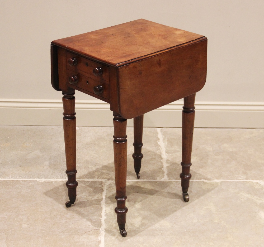 A mid 19th century mahogany work table, the rectangular drop leaf top with rounded corners, above