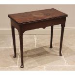 A George III mahogany tea table, the rectangular folding top upon cylindrical tapering legs