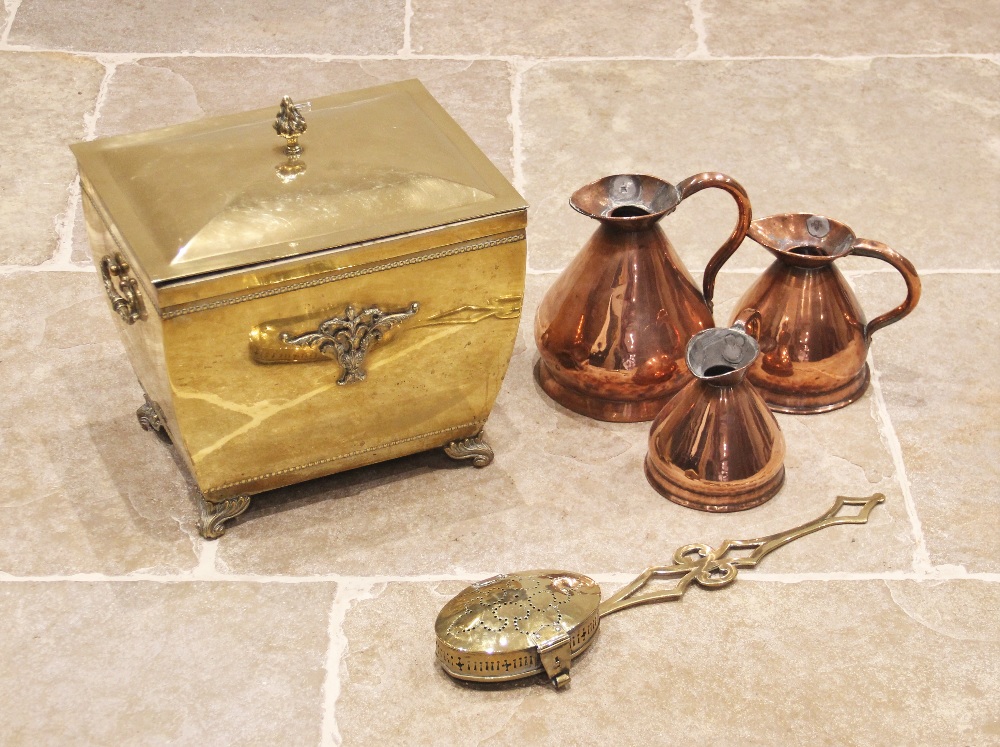 A Victorian brass coal/log bucket of sarcophagus form, the removable cover with a flame finial