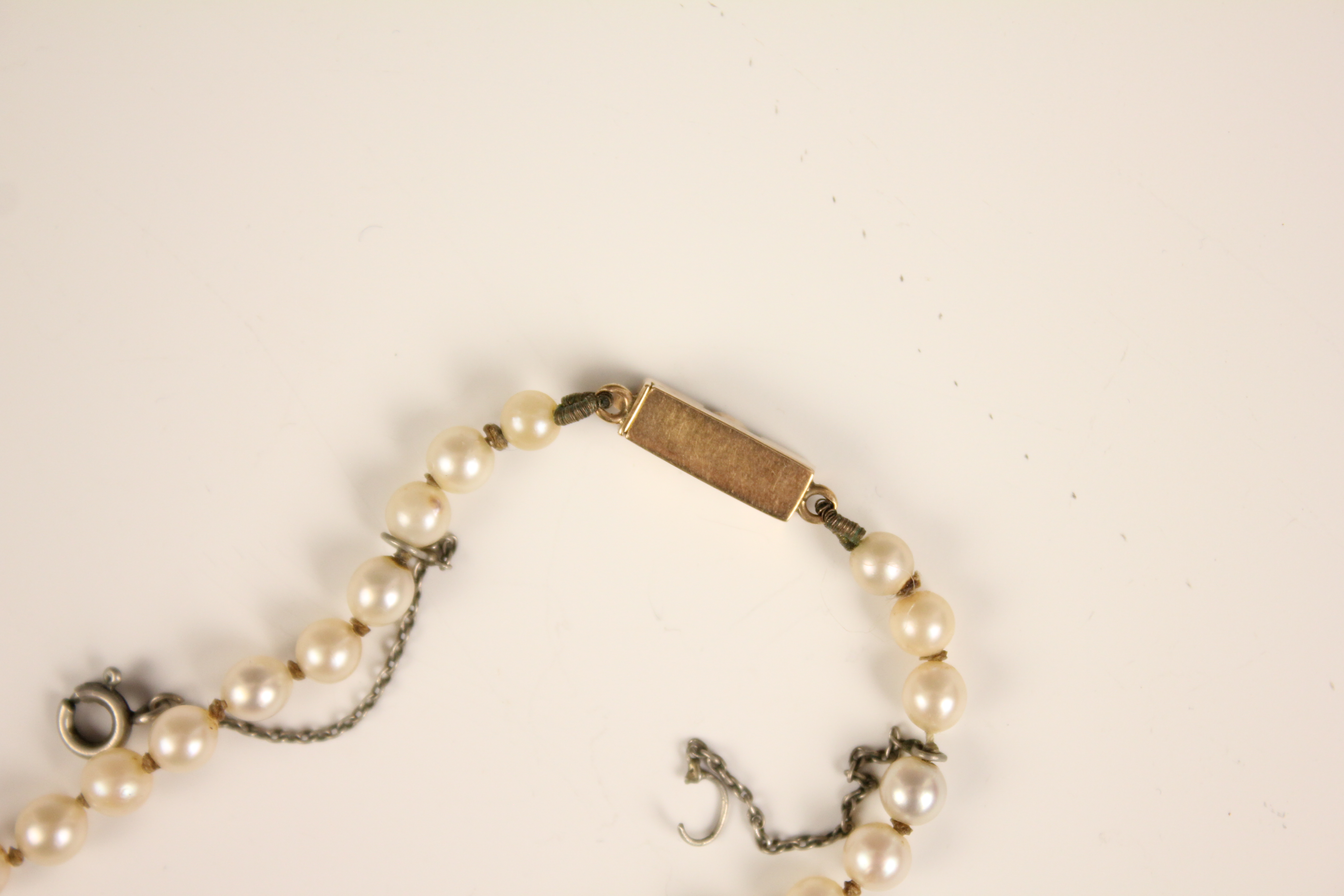 An early 20th century cultured pearl necklace, designed as a single row of round cultured pearls, - Image 11 of 12