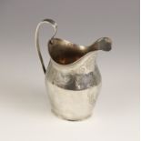 A George III silver milk jug, Peter, Ann & William Bateman, London 1800, of helmet form with loop