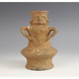 A South American figural pottery vessel, probably Columbian, of double annular form on flared