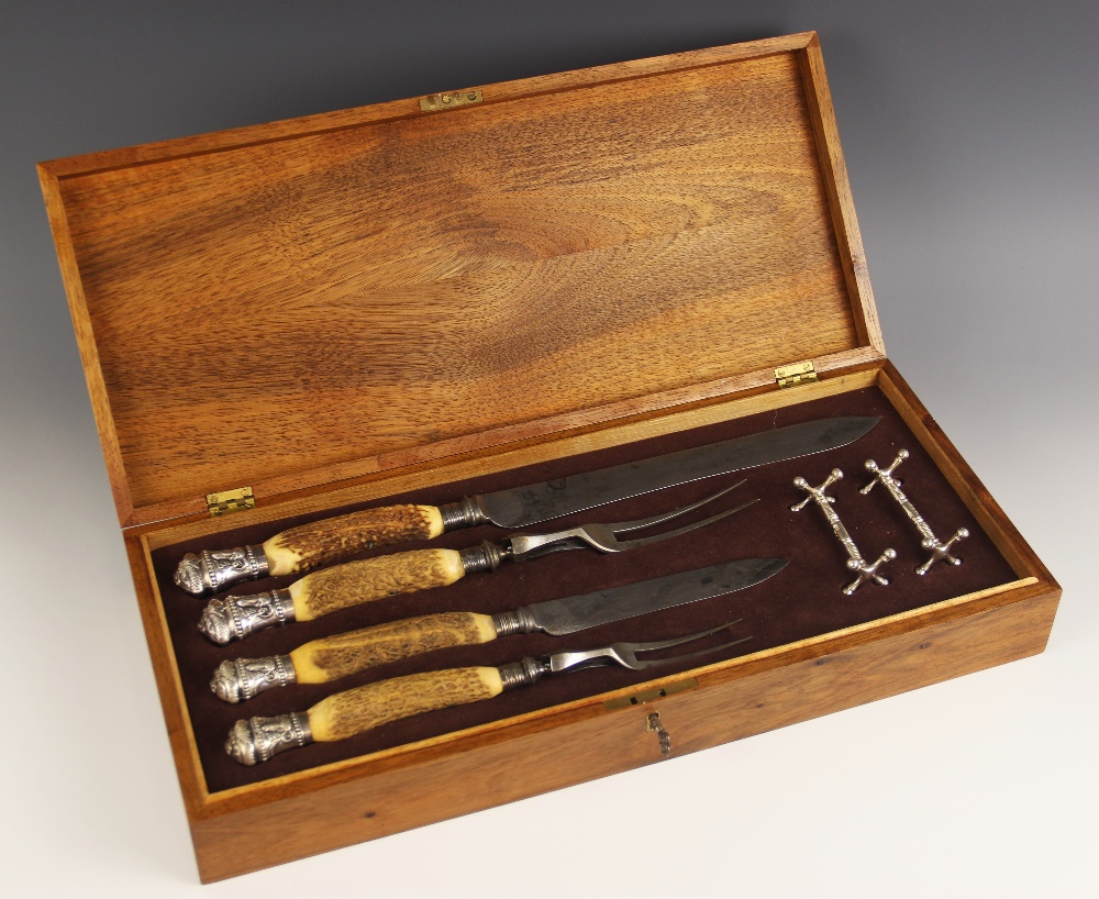 A cased Victorian carving set, Joseph Rodgers & Sons, Sheffield 1885, comprising two sets of