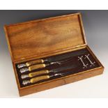 A cased Victorian carving set, Joseph Rodgers & Sons, Sheffield 1885, comprising two sets of