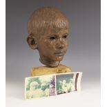 Maureen Coatman (British, 1919–2005), a clay bust of a young boy, signed at base of neck, finished