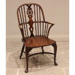 A George III style Windsor farmhouse elbow chair, by Glenister, High Wycombe, 20th century, the