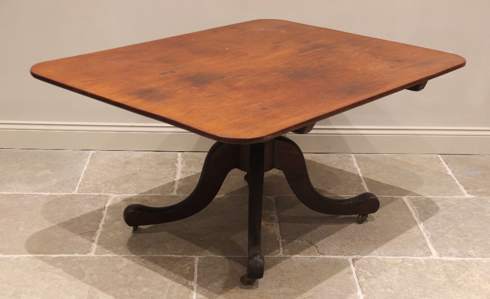 A 19th century mahogany centre/breakfast table, the rectangular tilt top with rounded corners upon a