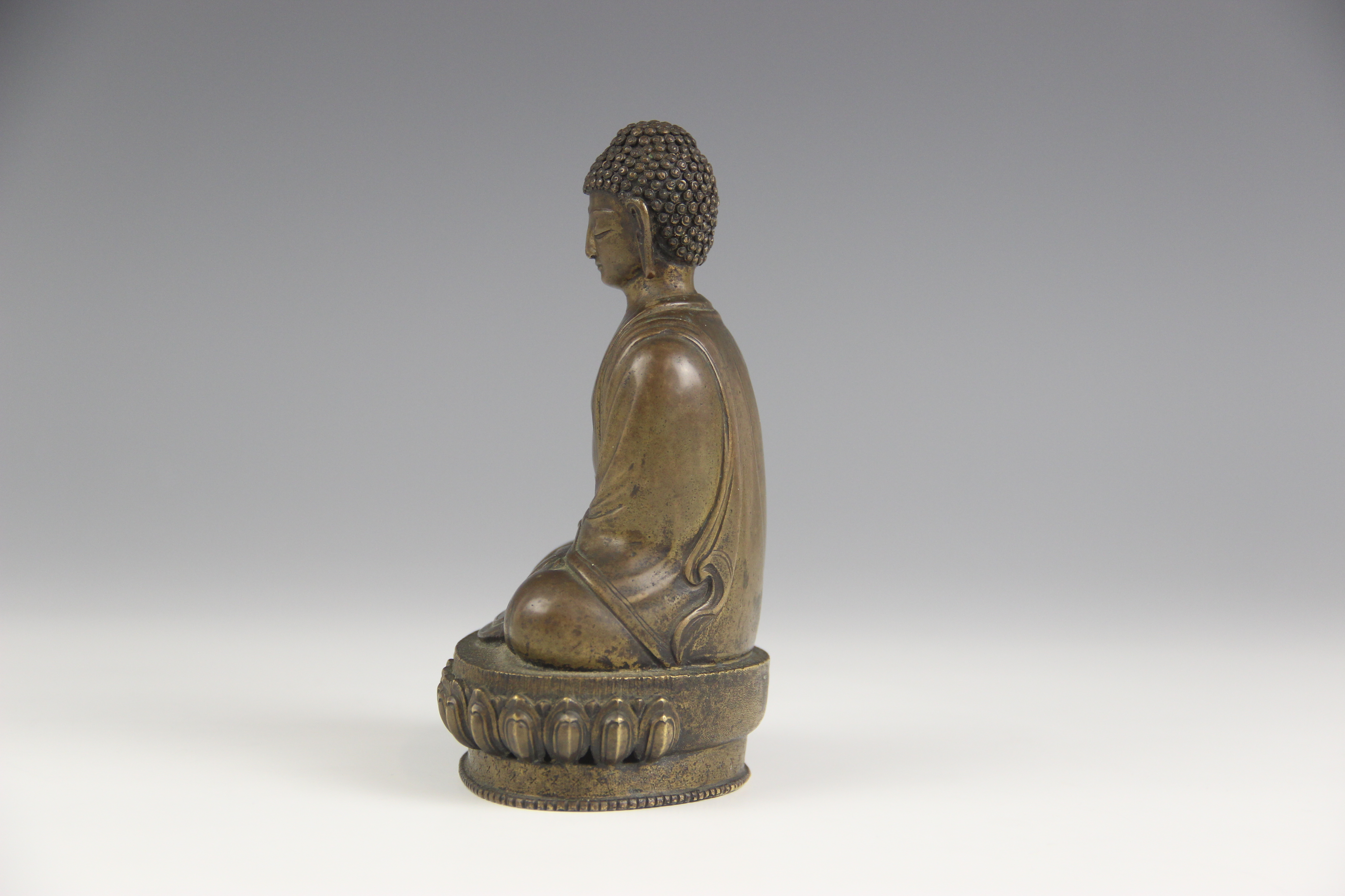 A bronze model of Buddha, possibly Sino-Tibetan, 18th/19th century, modelled seated in dhyanasana on - Image 4 of 5