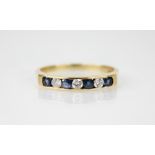 A sapphire and diamond seven-stone ring, comprising four round mixed cut sapphires interspersed by