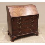 A George III mahogany bureau, the quarter veneered fall front opening to a compartmentalised