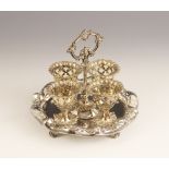 A silver plated egg cruet by Elkington & Co, comprising four egg cups, each with pierced