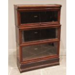 A Globe Wernicke walnut three tier stacking bookcase, early 20th century, each tier with an 'up
