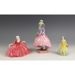 Three early Royal Doulton figurines, early 20th century, comprising: HN1412 Pantalettes and HN549