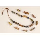 Eight loose Venetian glass African trade beads, 19th century, each millefiori bead of tubular