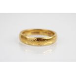 A George V 22ct gold wedding band, Pleasance & Harper Ltd, Birmingham 1929, ring size N 1/2,